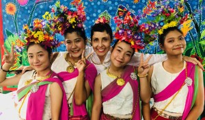 Suzanne Gregoire (choreography) with students in their floral tiaras in front of our Mae Ping River Garden mural for the Universal Mother performance.