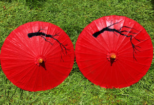 Parasols painted with branches drying in the sun