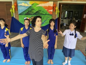 Ms. Grégoire rehearsing some students for the "Mae Ping" dance performance