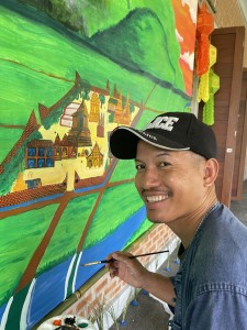Local artist, Worawuth Srakeo contributes his skills to one of our murals used as the backdrop for our "Mae Ping" Performance